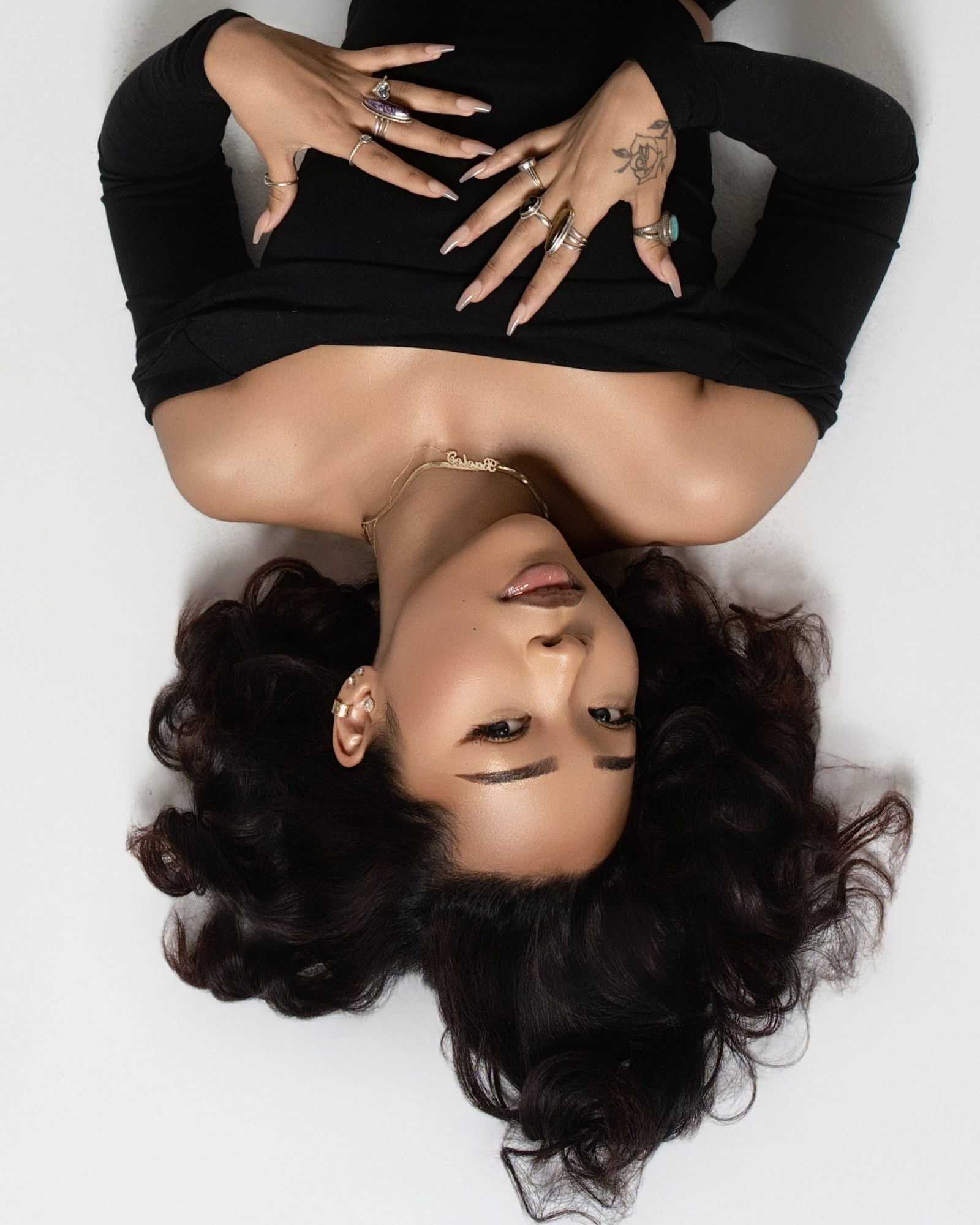 Graphic studio beauty portrait with expressive hands