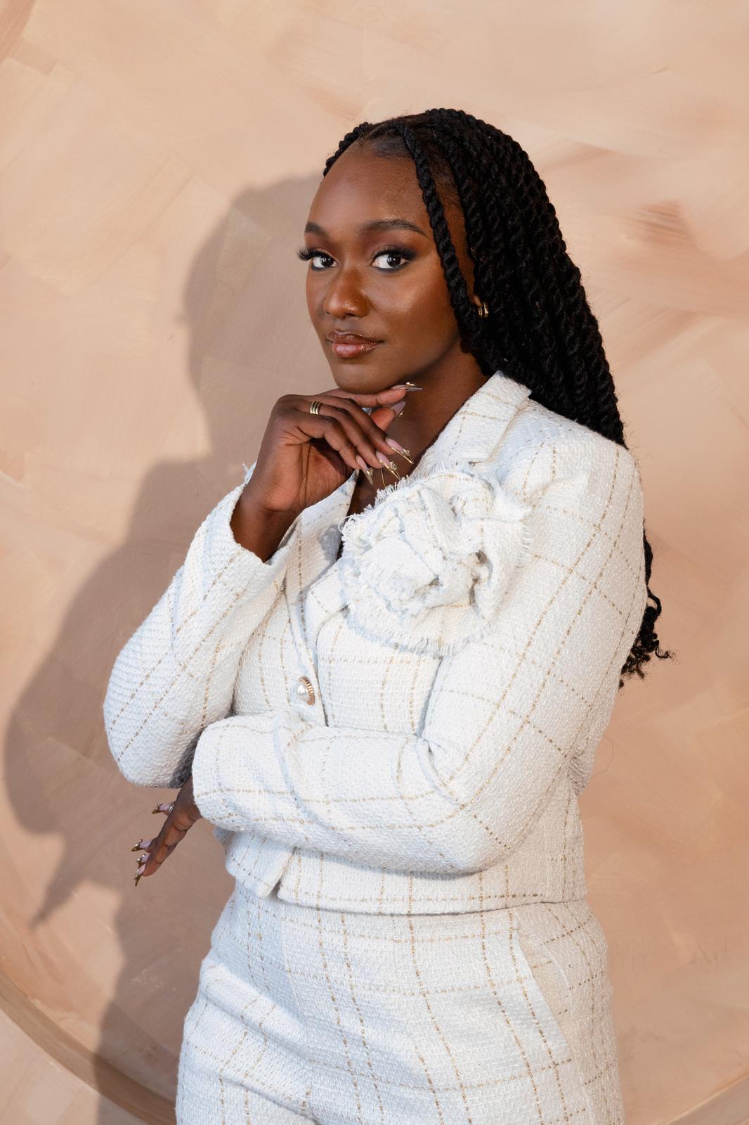 Confident founder portrait in a white suit
